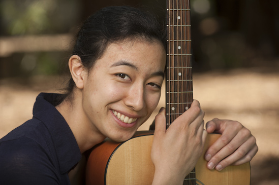 2015 Strauss winner holding guitar