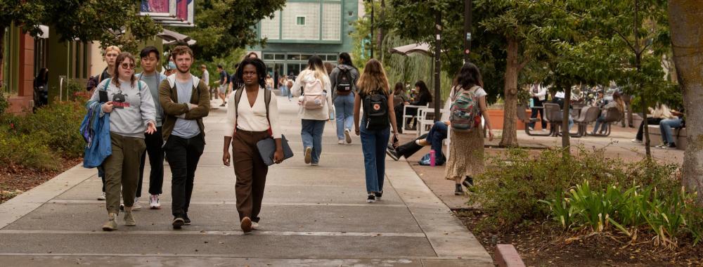 Students walking near Shields Library