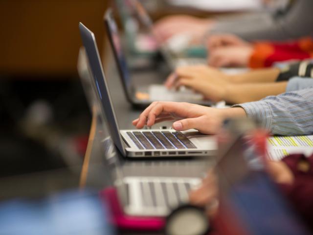Close-up of laptops in use in class