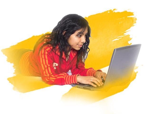 Student on laptop with yellow background