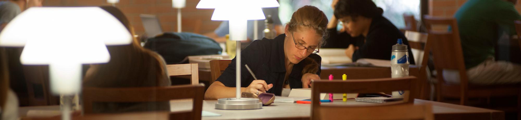 student studying in law library