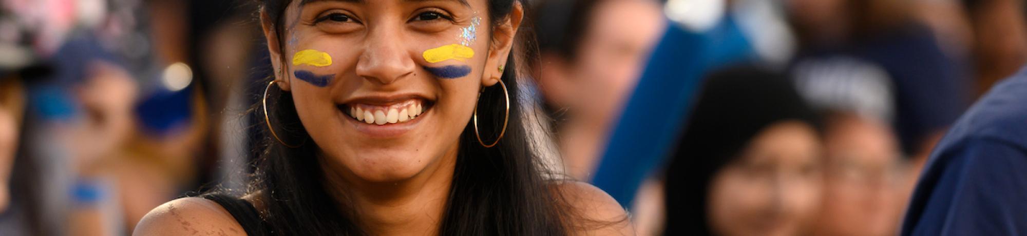 Student at homecoming wearing facepaint