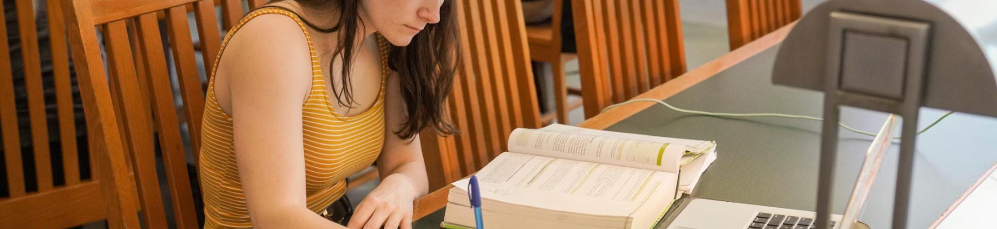 Student studying in the law library